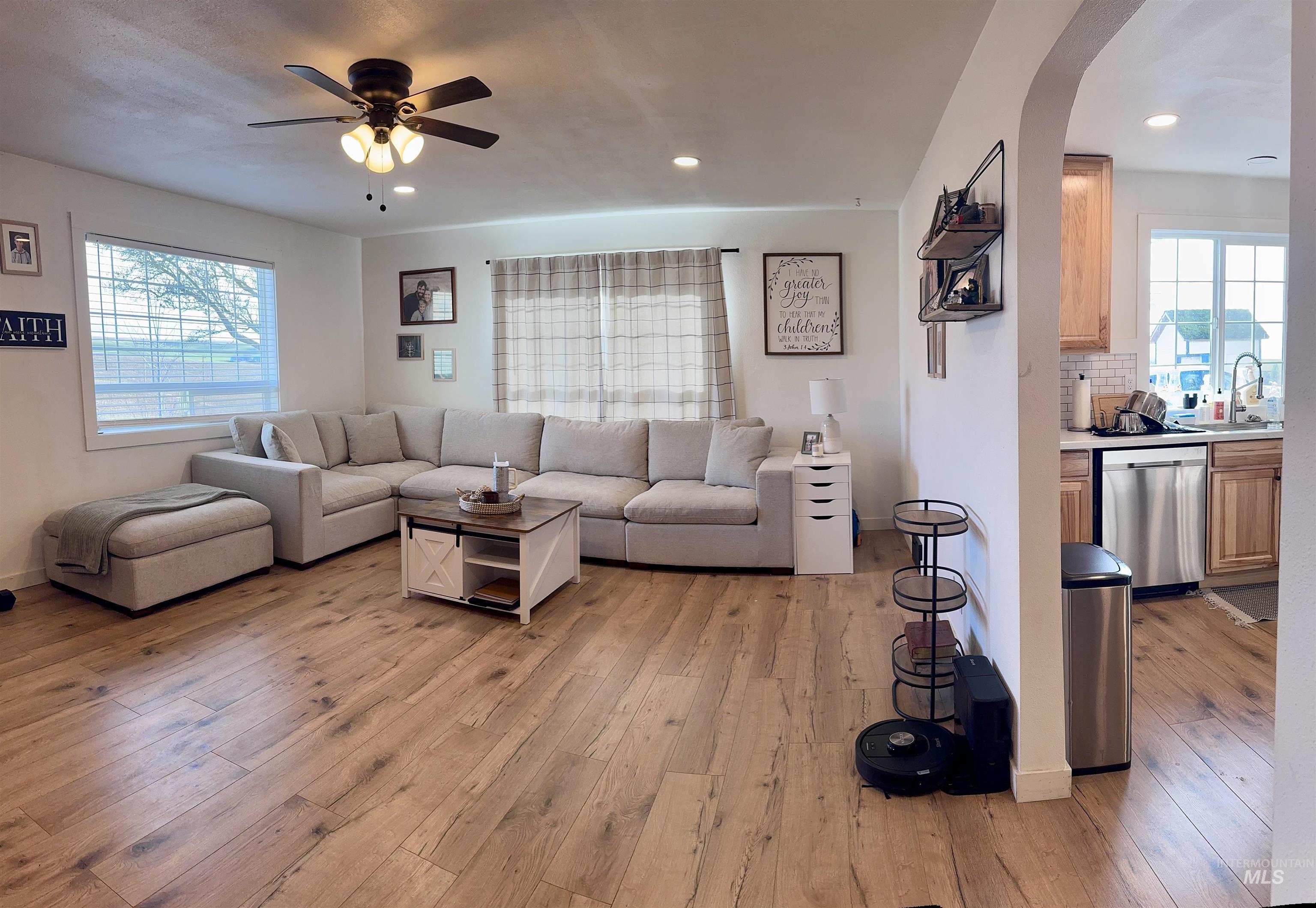 16078 Hoffman Road Kendrick, ID 83537 - Photo 6 of 29 Living area with light wood finished floors, ceiling fan, recessed lighting, and arched walkways