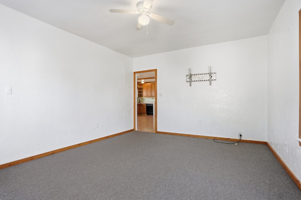 12 Whitcomb Street Webster, MA 01570 - Photo 16 of 40 an empty room with a empty space and a ceiling fan
