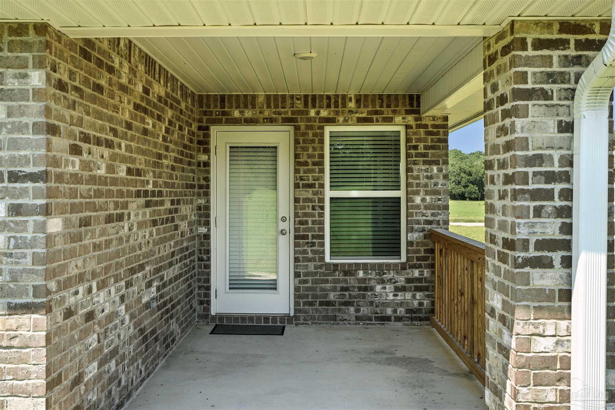 4710 Carl Booker Road Milton, FL 32583 - Photo 11 of 54 a view of a door with an outdoor space