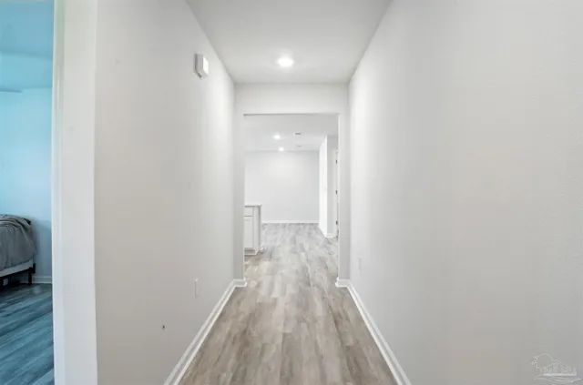 a view of bedroom with wooden floor