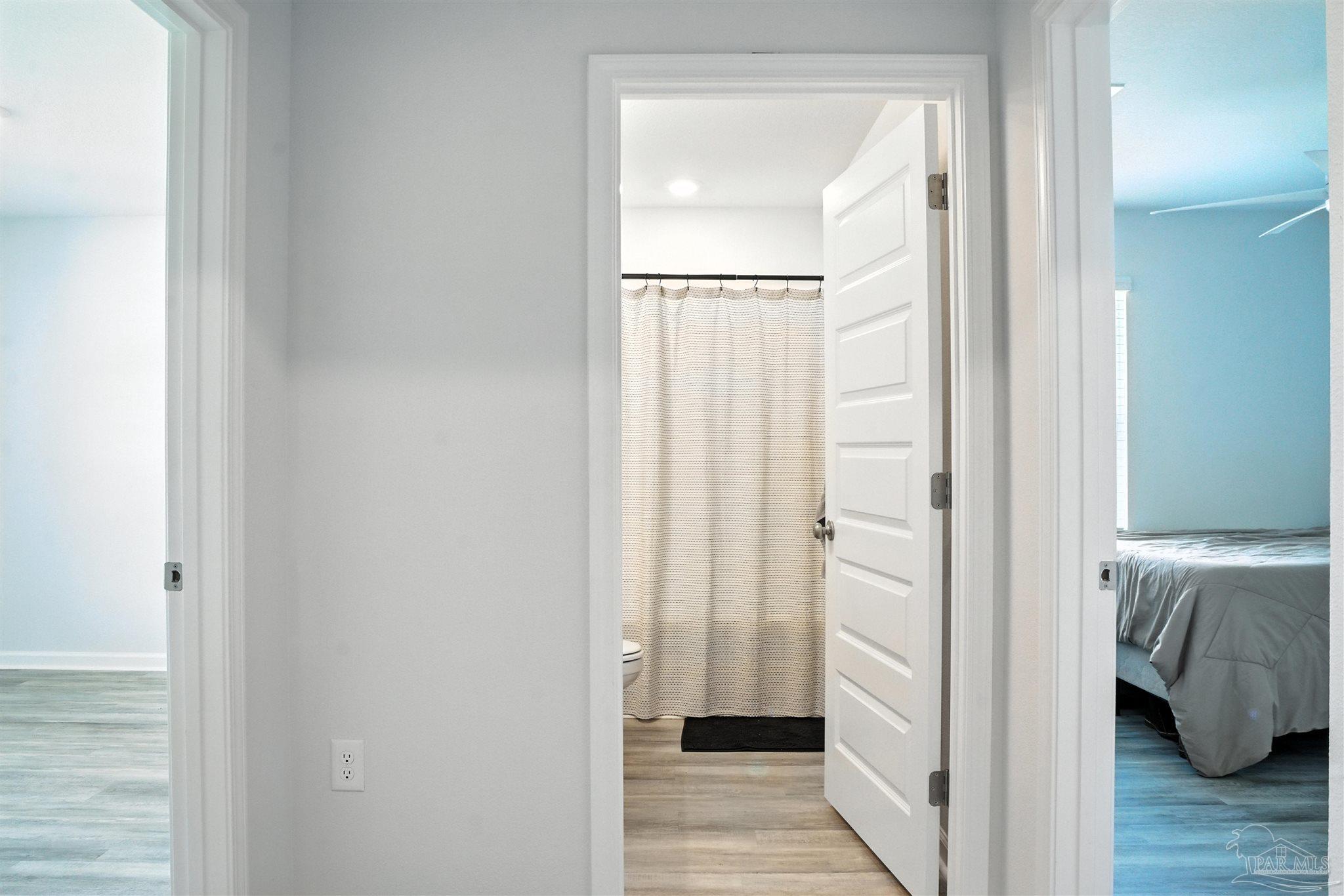 4710 Carl Booker Road Milton, FL 32583 - Photo 13 of 54 a view of bedroom with wooden floor