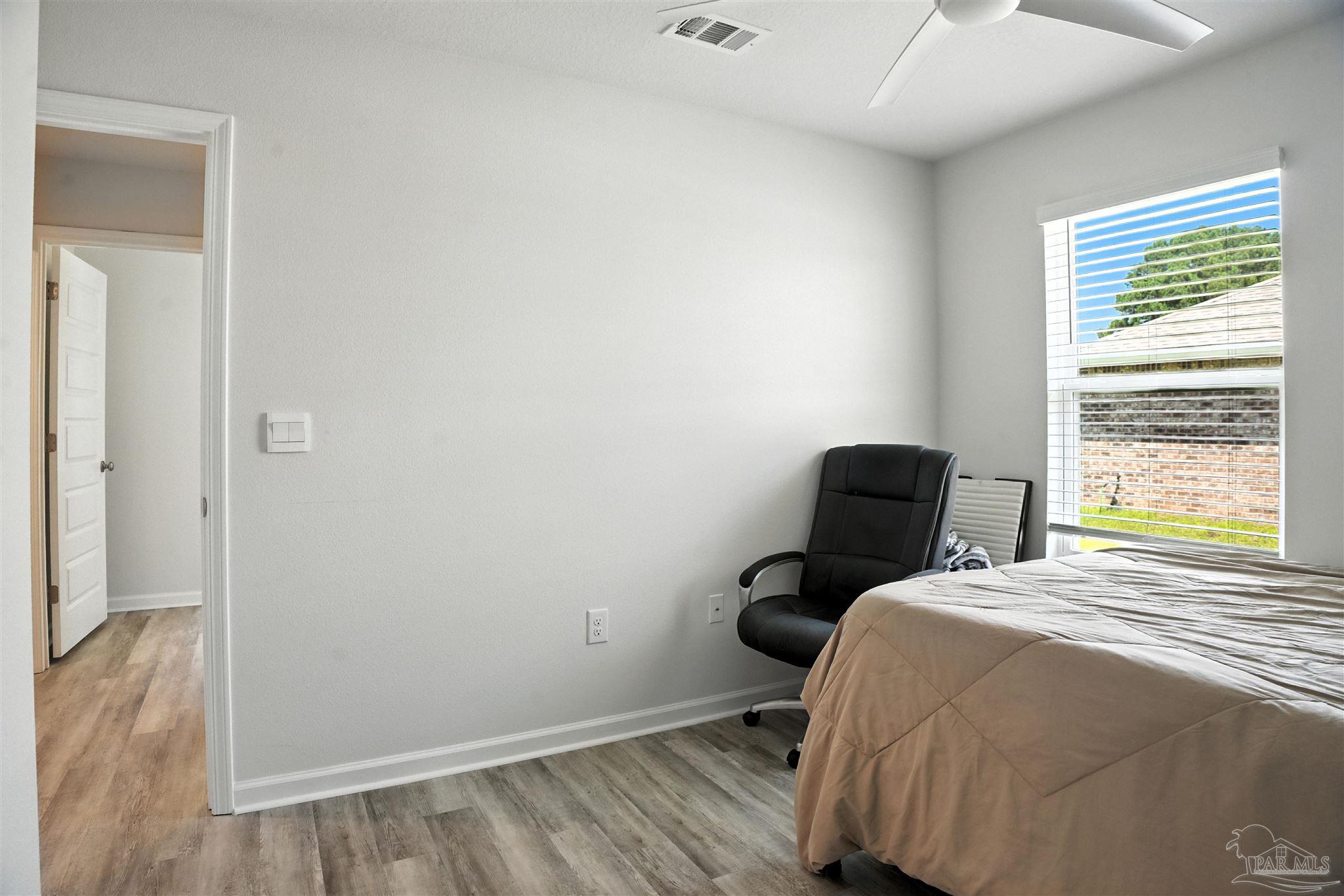 4710 Carl Booker Road Milton, FL 32583 - Photo 17 of 54 a bedroom with a bed and a window