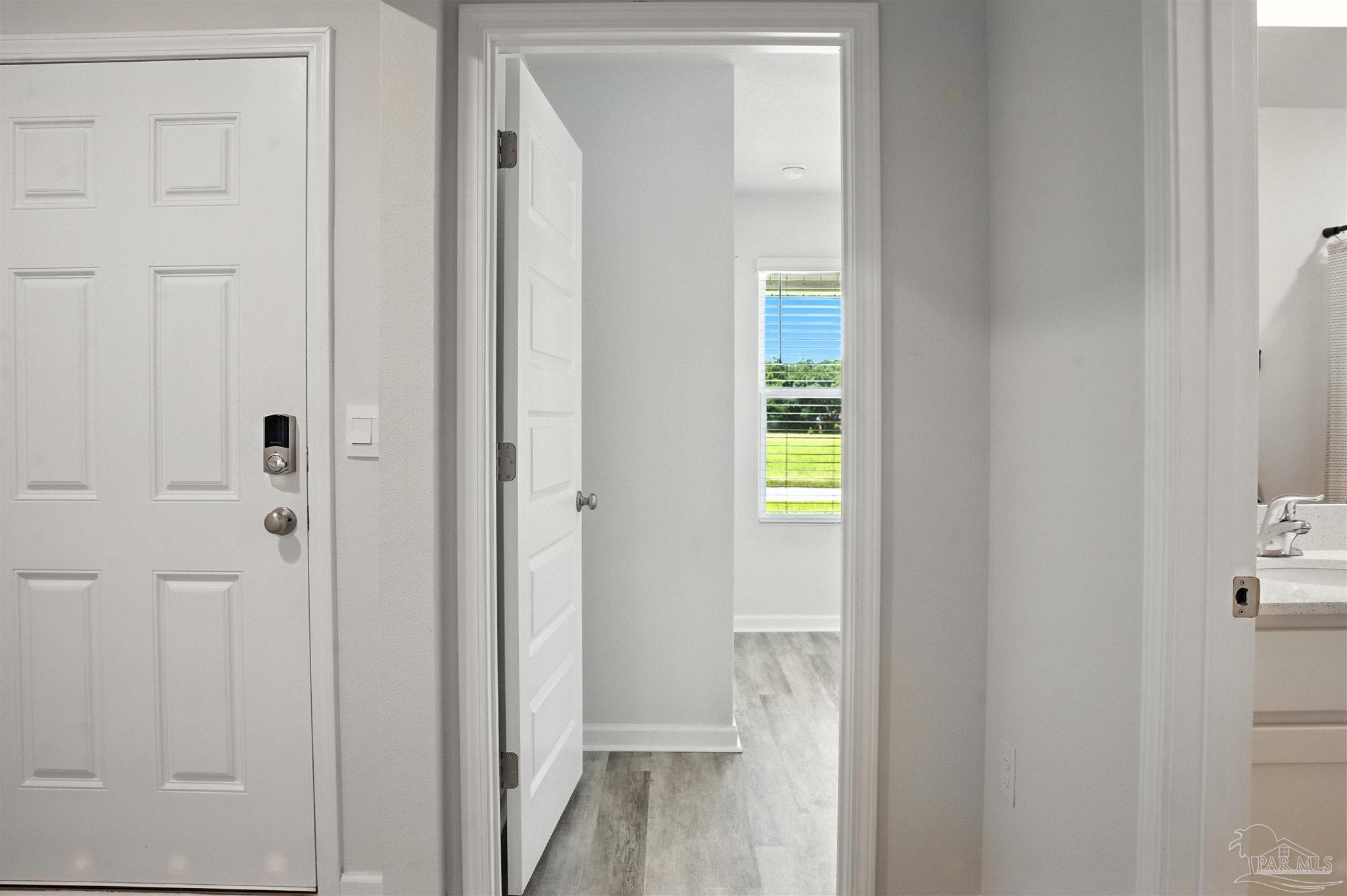 4710 Carl Booker Road Milton, FL 32583 - Photo 18 of 54 a view of a bathroom from the hallway
