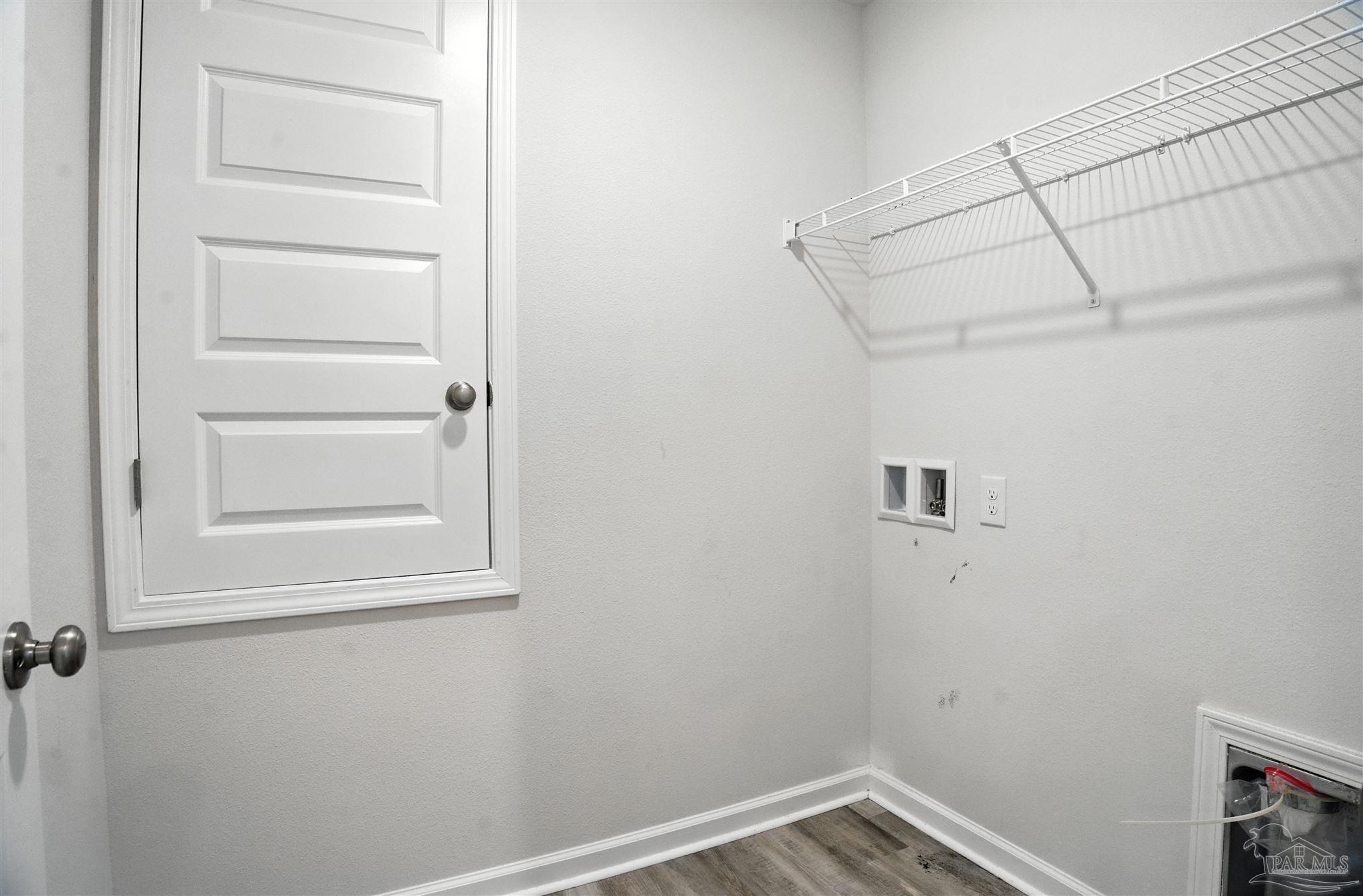 4710 Carl Booker Road Milton, FL 32583 - Photo 26 of 54 a view of a room with rack on the wall