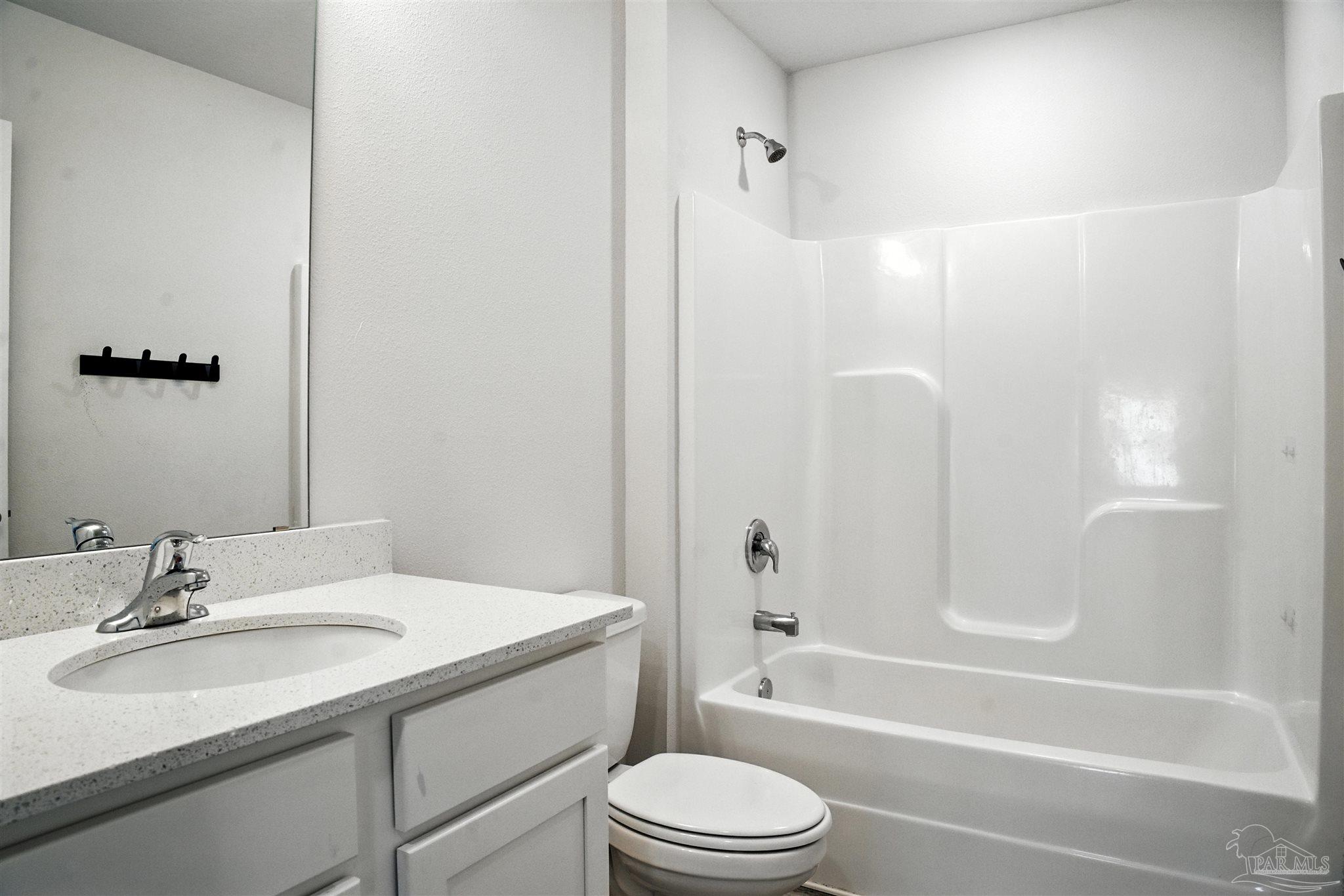 4710 Carl Booker Road Milton, FL 32583 - Photo 30 of 54 a bathroom with a sink a toilet and shower