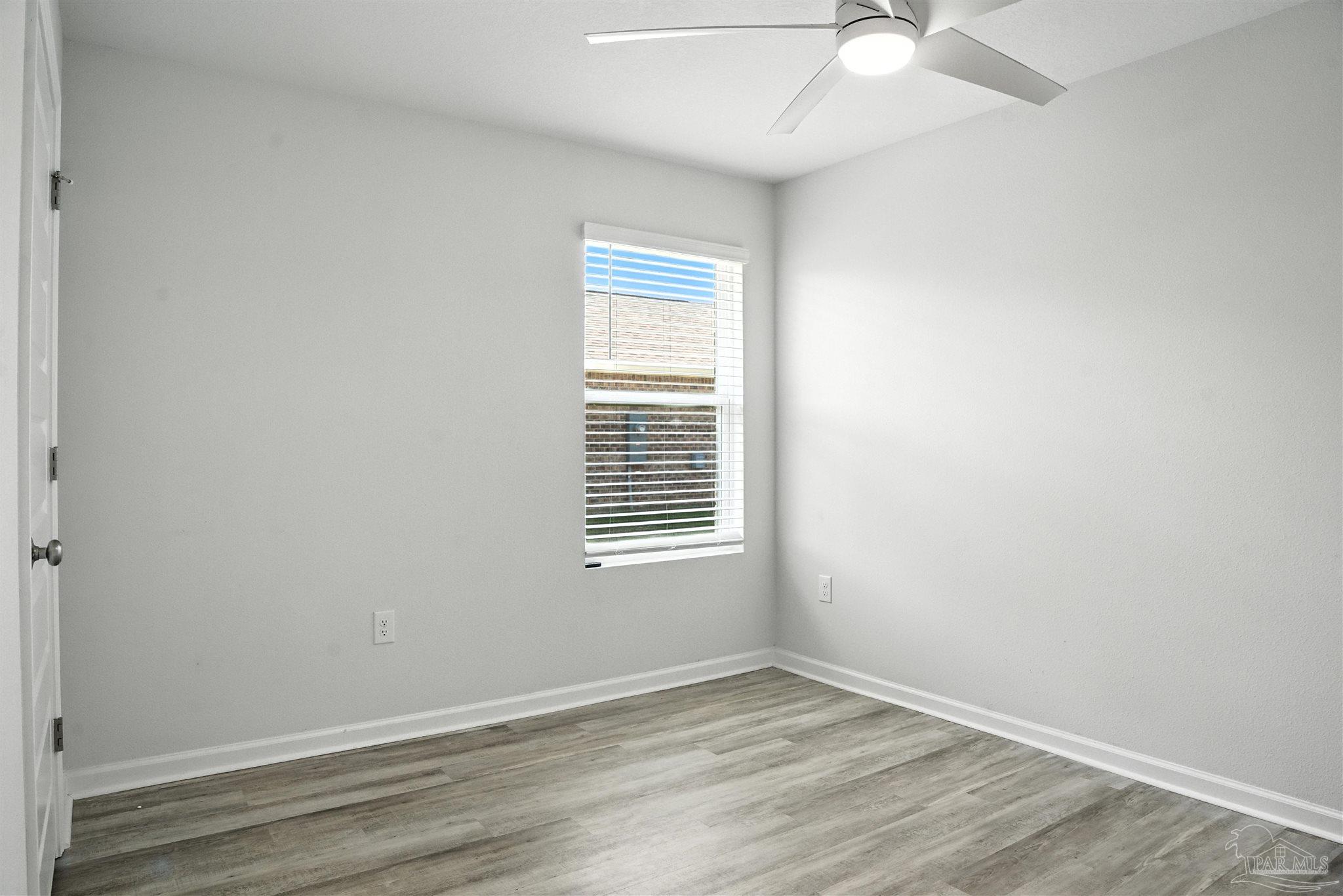 4710 Carl Booker Road Milton, FL 32583 - Photo 31 of 54 an empty room with a window
