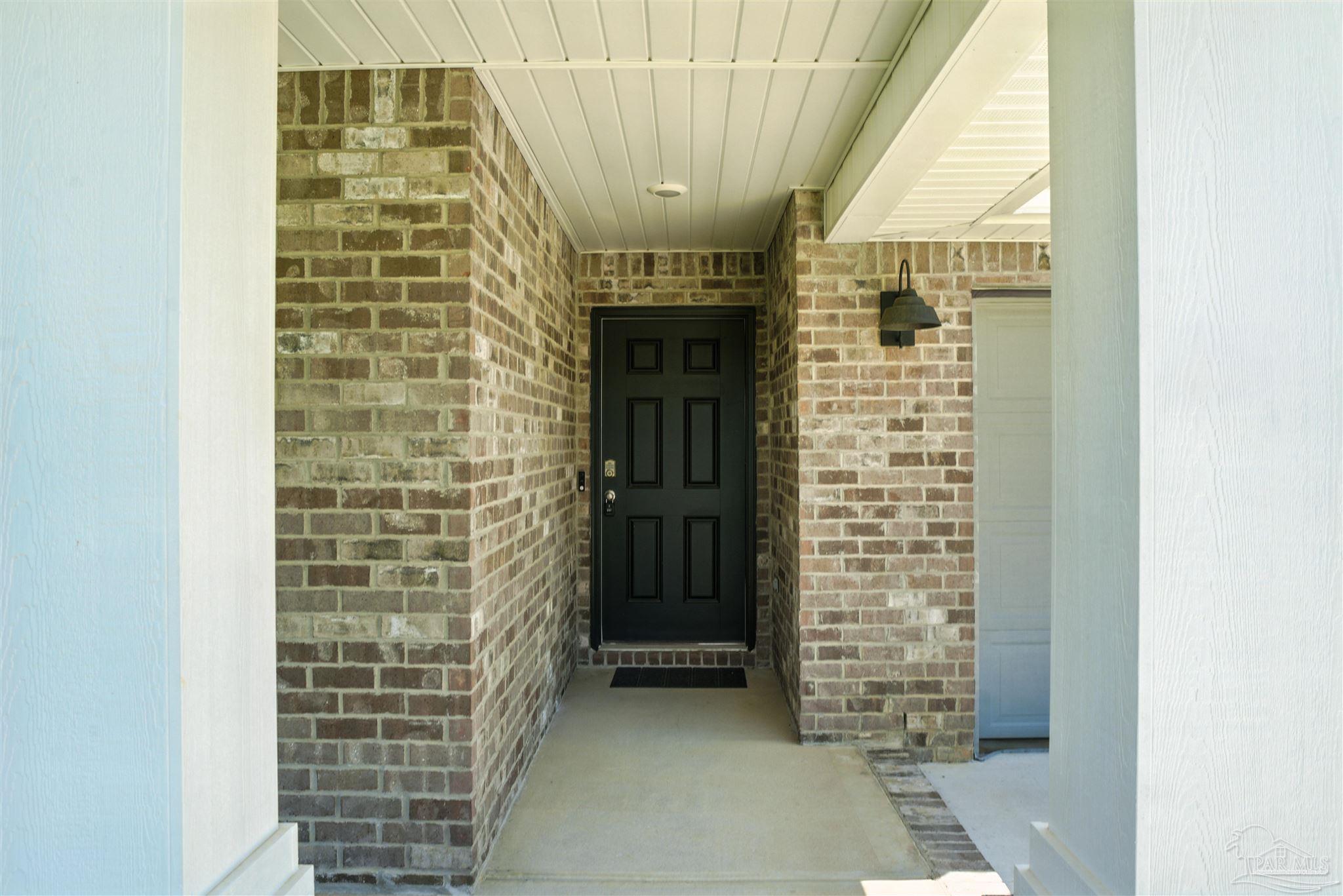 4710 Carl Booker Road Milton, FL 32583 - Photo 4 of 54 a view of entryway with brick walls