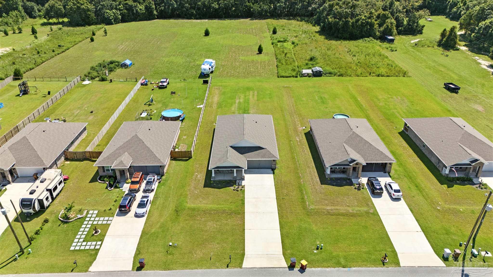 4710 Carl Booker Road Milton, FL 32583 - Photo 45 of 54 an aerial view of a swimming pool
