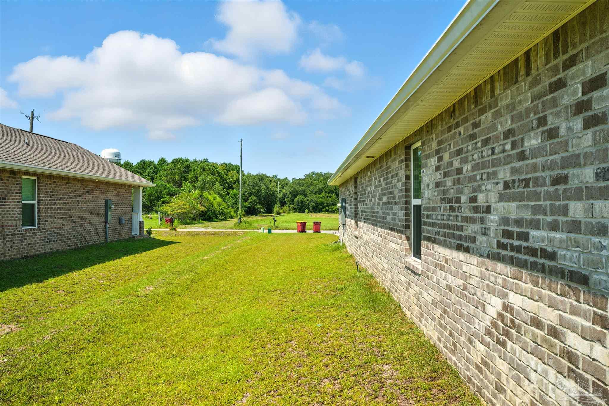 4710 Carl Booker Road Milton, FL 32583 - Photo 5 of 54 a view of swimming pool with a yard