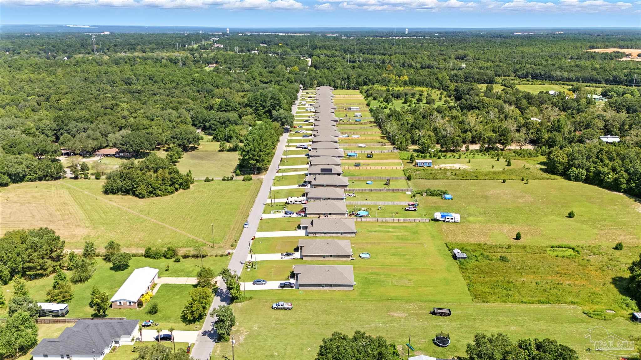 4710 Carl Booker Road Milton, FL 32583 - Photo 53 of 54 an aerial view of residential houses with outdoor space