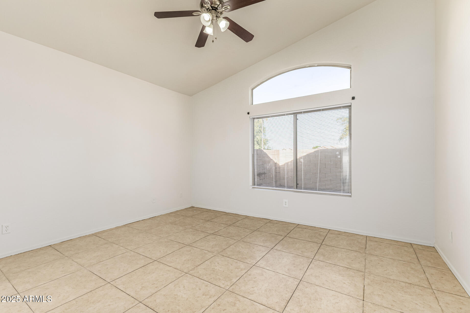 10628 West Coronado Road Avondale, AZ 85392 - Photo 11 of 29 an empty room with a window