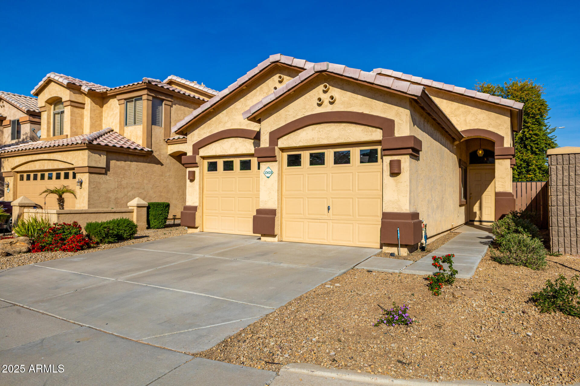 10628 West Coronado Road Avondale, AZ 85392 - Photo 2 of 29 a front view of a house