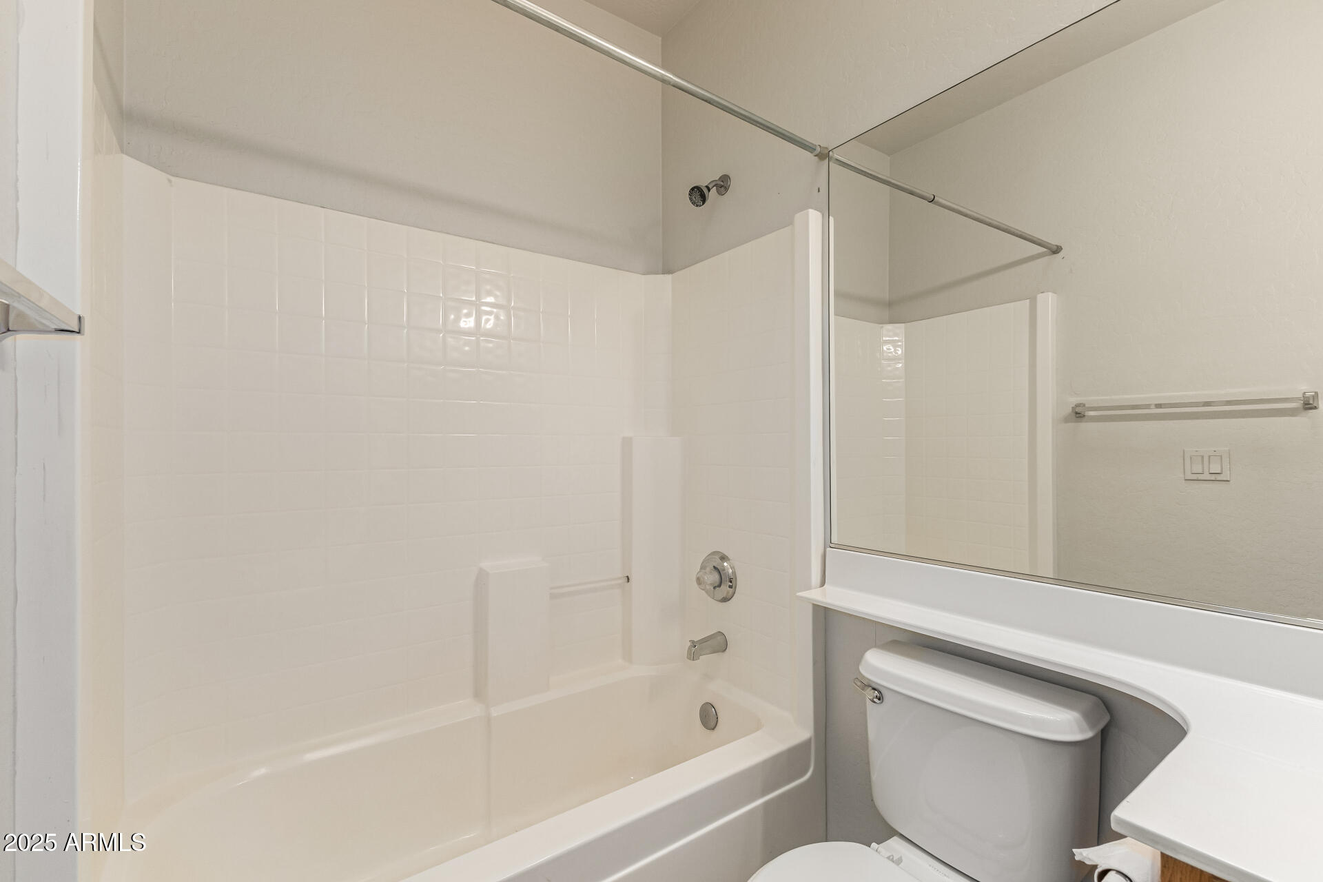 10628 West Coronado Road Avondale, AZ 85392 - Photo 22 of 29 a bathroom with a shower and a toilet