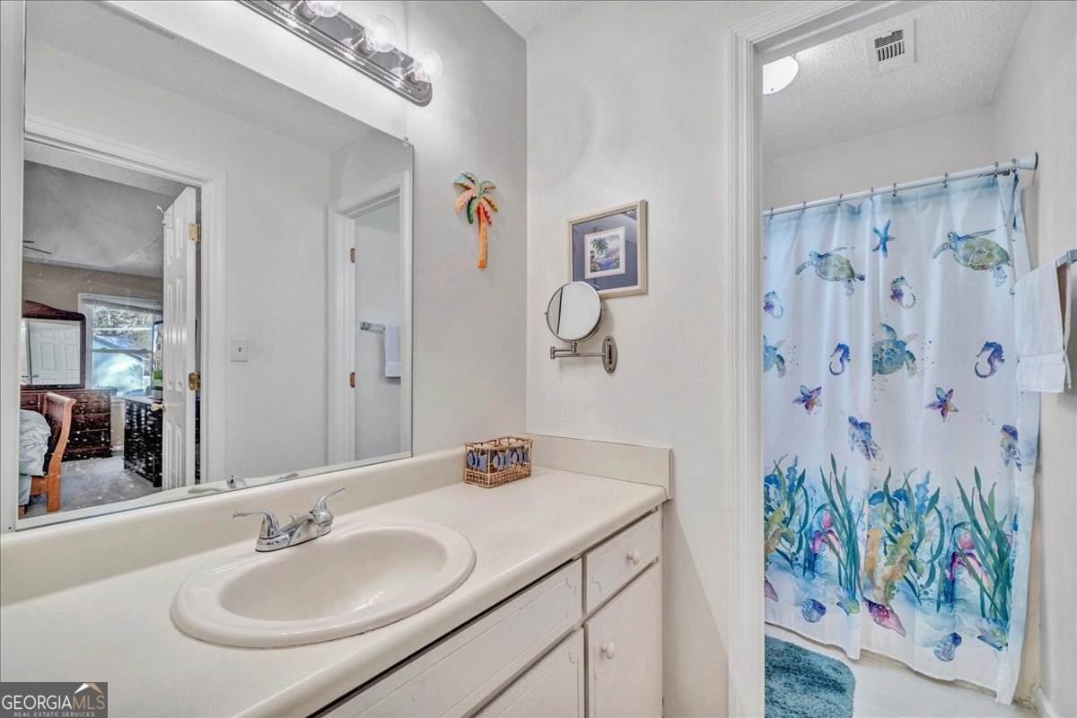 637 Will Scarlet Way Macon, GA 31220 - Photo 18 of 38 a bathroom with a sink and a mirror