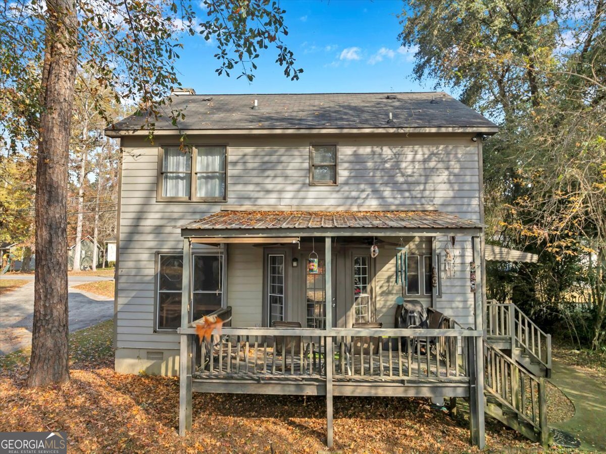 637 Will Scarlet Way Macon, GA 31220 - Photo 34 of 38 a view of a house with a window and wooden fence