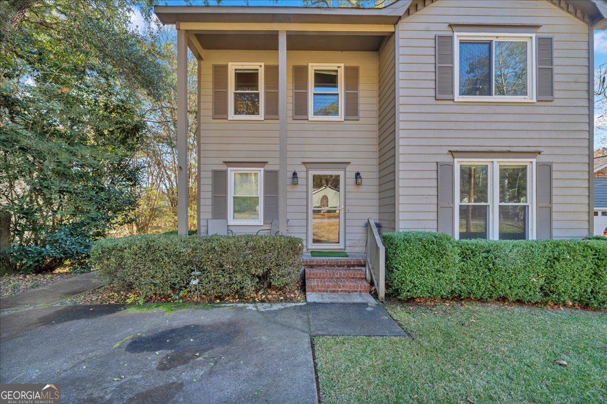 637 Will Scarlet Way Macon, GA 31220 - Photo 4 of 38 a front view of a house with a yard