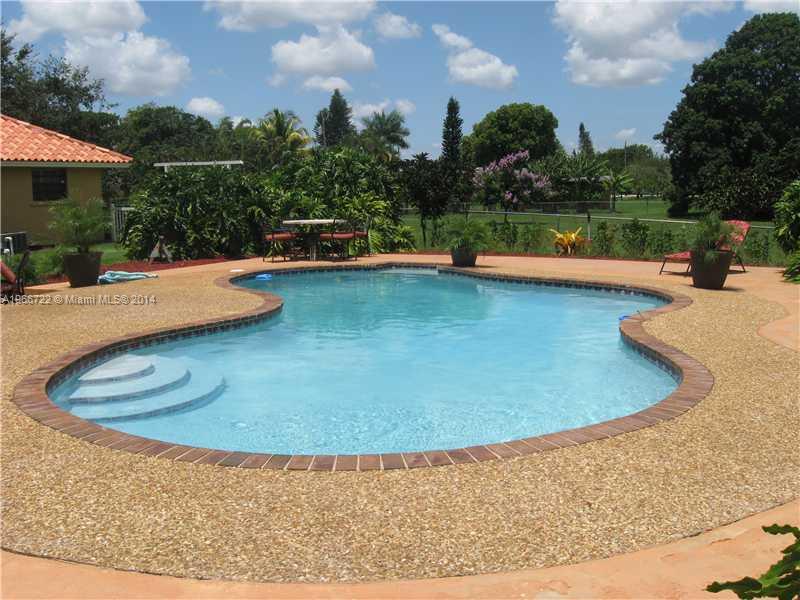 17641 Southwest 70th Place Southwest Ranches, FL 33331 - Photo 11 of 24 a view of a swimming pool with a yard
