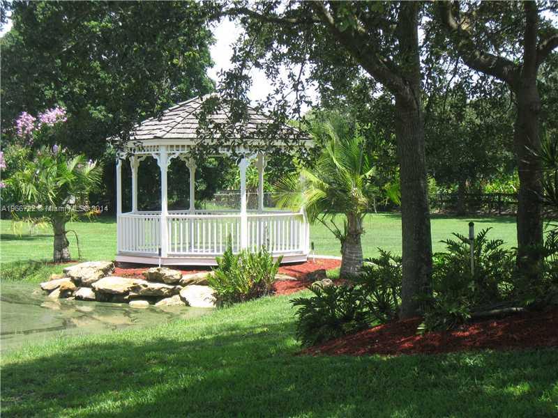 17641 Southwest 70th Place Southwest Ranches, FL 33331 - Photo 23 of 24 a garden view with a seating space