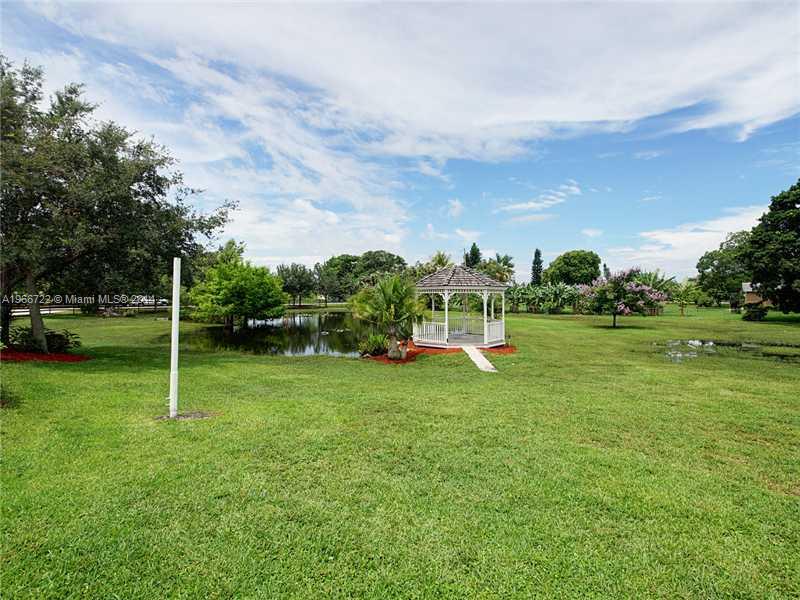 17641 Southwest 70th Place Southwest Ranches, FL 33331 - Photo 24 of 24 a view of a house with a backyard