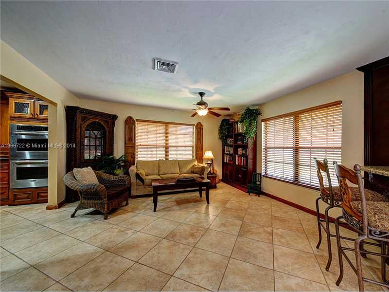 17641 Southwest 70th Place Southwest Ranches, FL 33331 - Photo 5 of 24 a living room with furniture and a flat screen tv