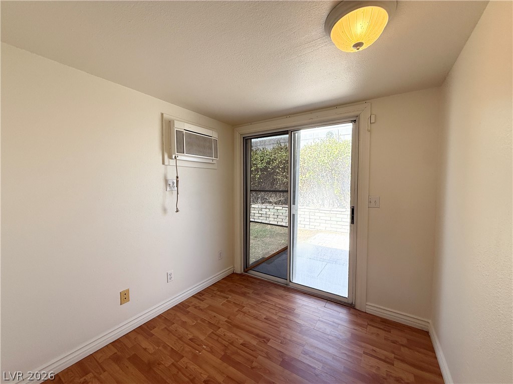 616 Greenway Road Henderson, NV 89002 - Photo 9 of 32 A sliding glass door provides abundant natural illumination in this comfortable living area.