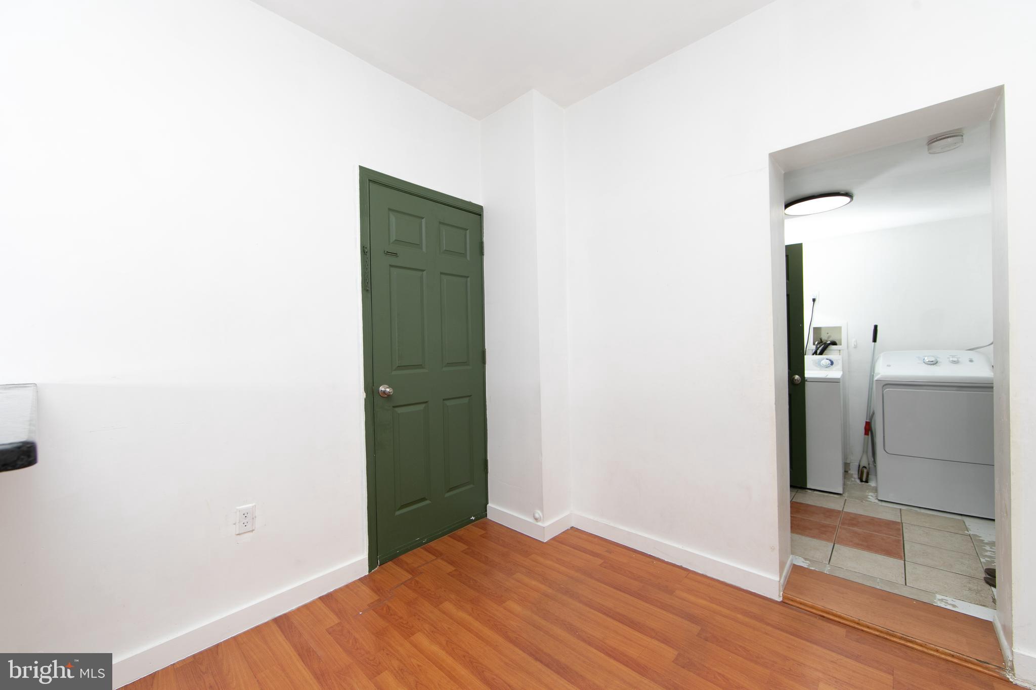 876 North 19th Street Philadelphia, PA 19130 - Photo 14 of 49 a view of a room with wooden floor and a bathroom
