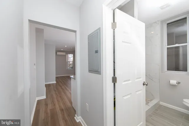 a view of a bathroom from a hallway