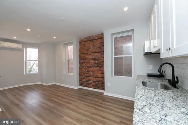 a view of a kitchen with a sink and dishwasher