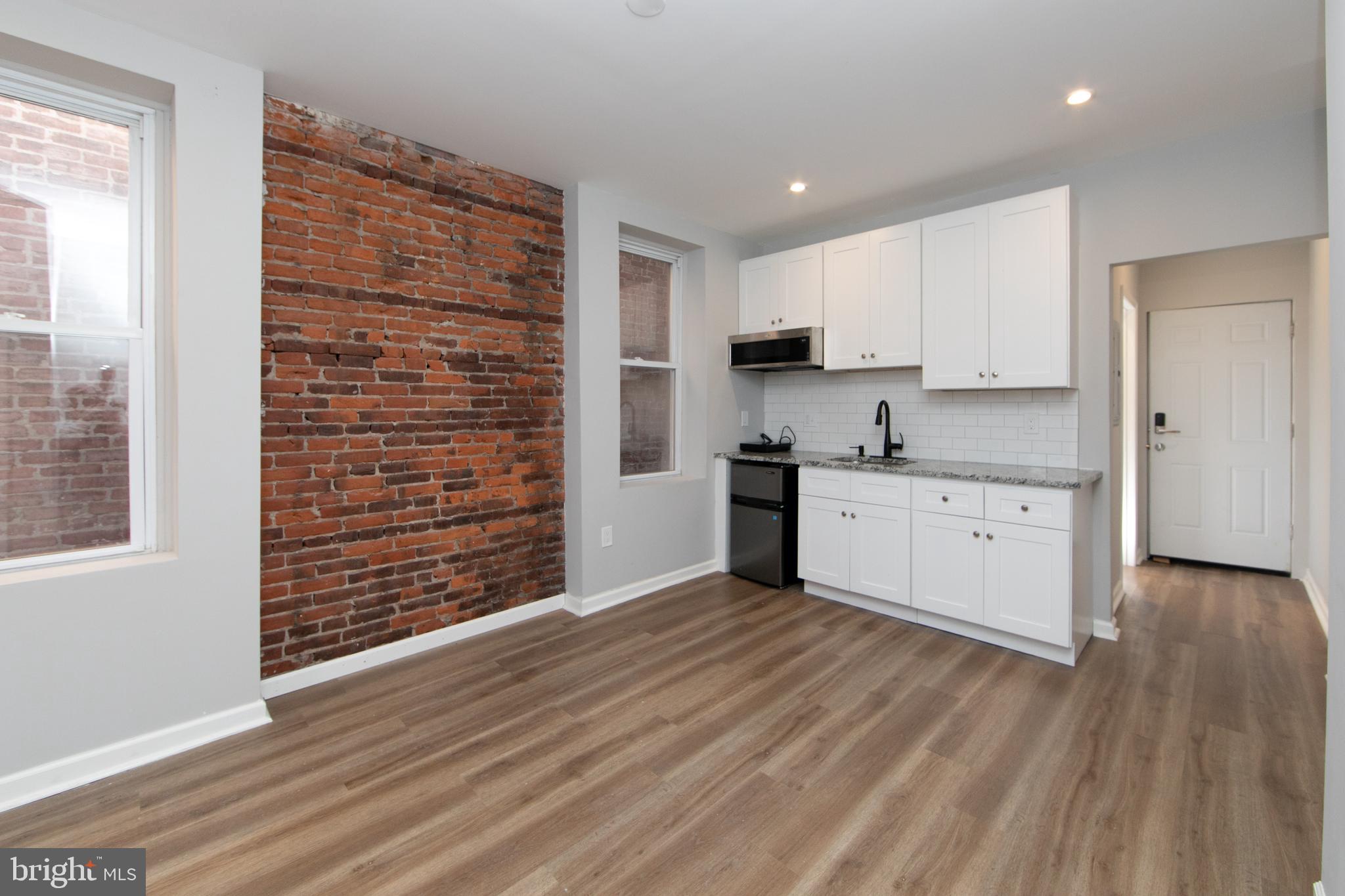 876 North 19th Street Philadelphia, PA 19130 - Photo 26 of 49 a view of kitchen with wooden floor