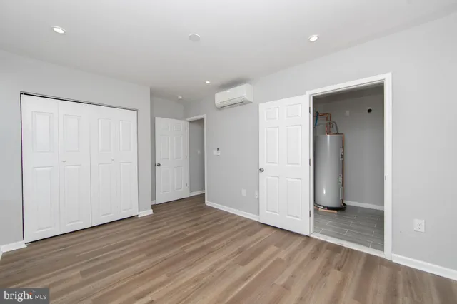 a view of hallway with wooden floor