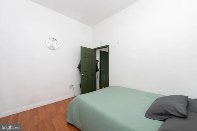 a bedroom with a bed and a table