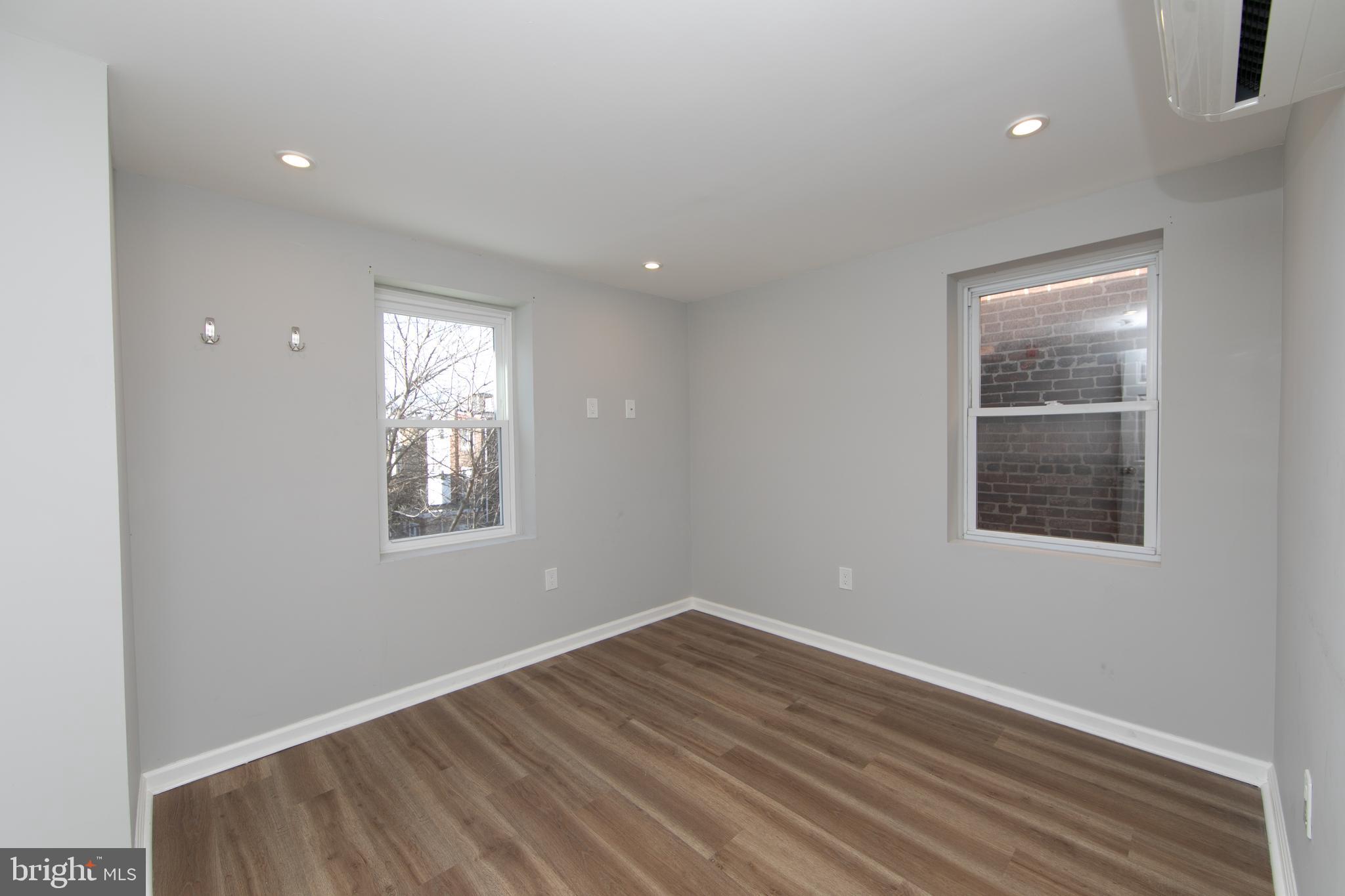 876 North 19th Street Philadelphia, PA 19130 - Photo 44 of 49 an empty room with windows and closet