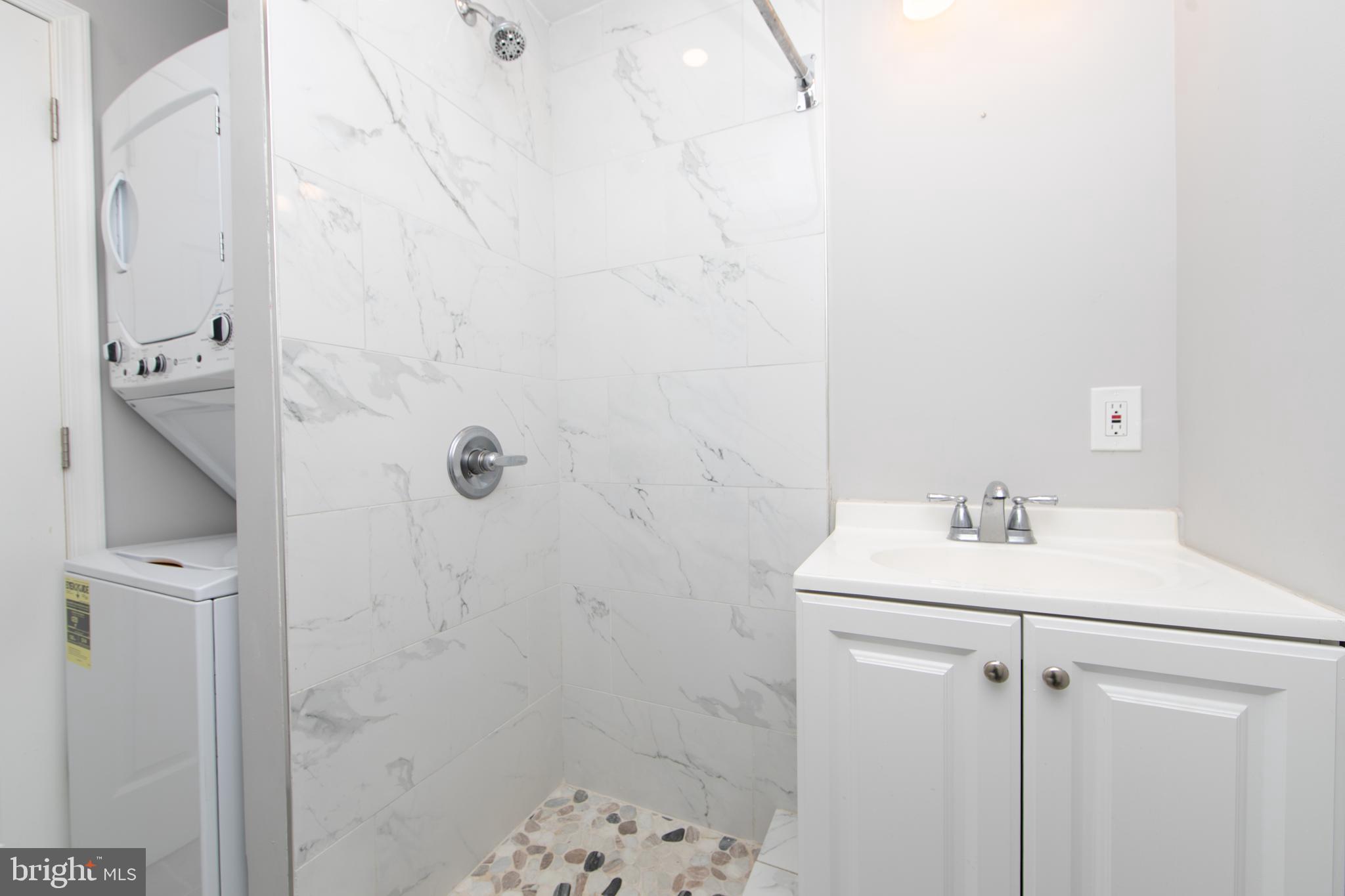 876 North 19th Street Philadelphia, PA 19130 - Photo 47 of 49 a bathroom with a sink a toilet and shower