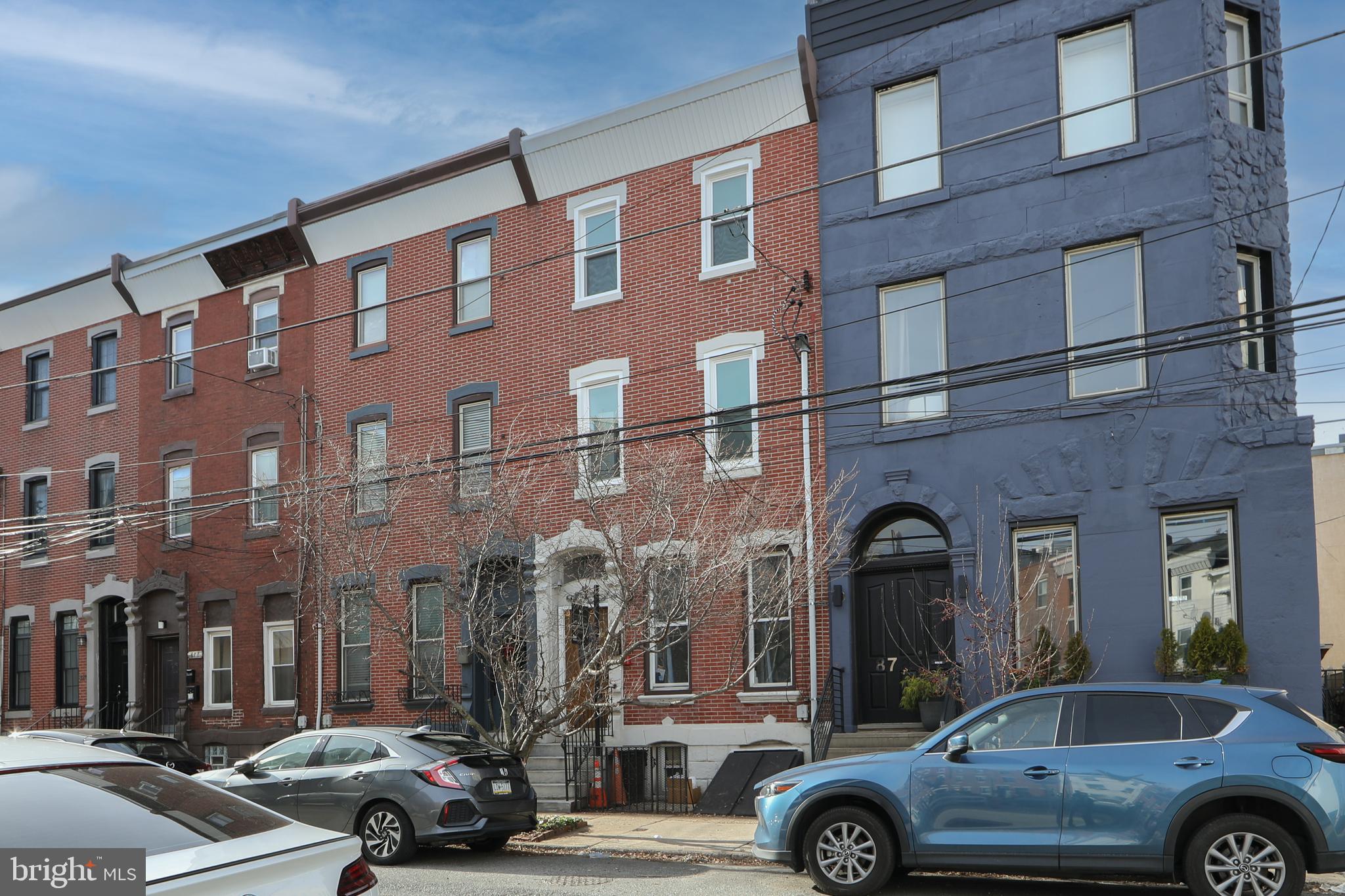 876 North 19th Street Philadelphia, PA 19130 - Photo 48 of 49 a front view of a building with parking space