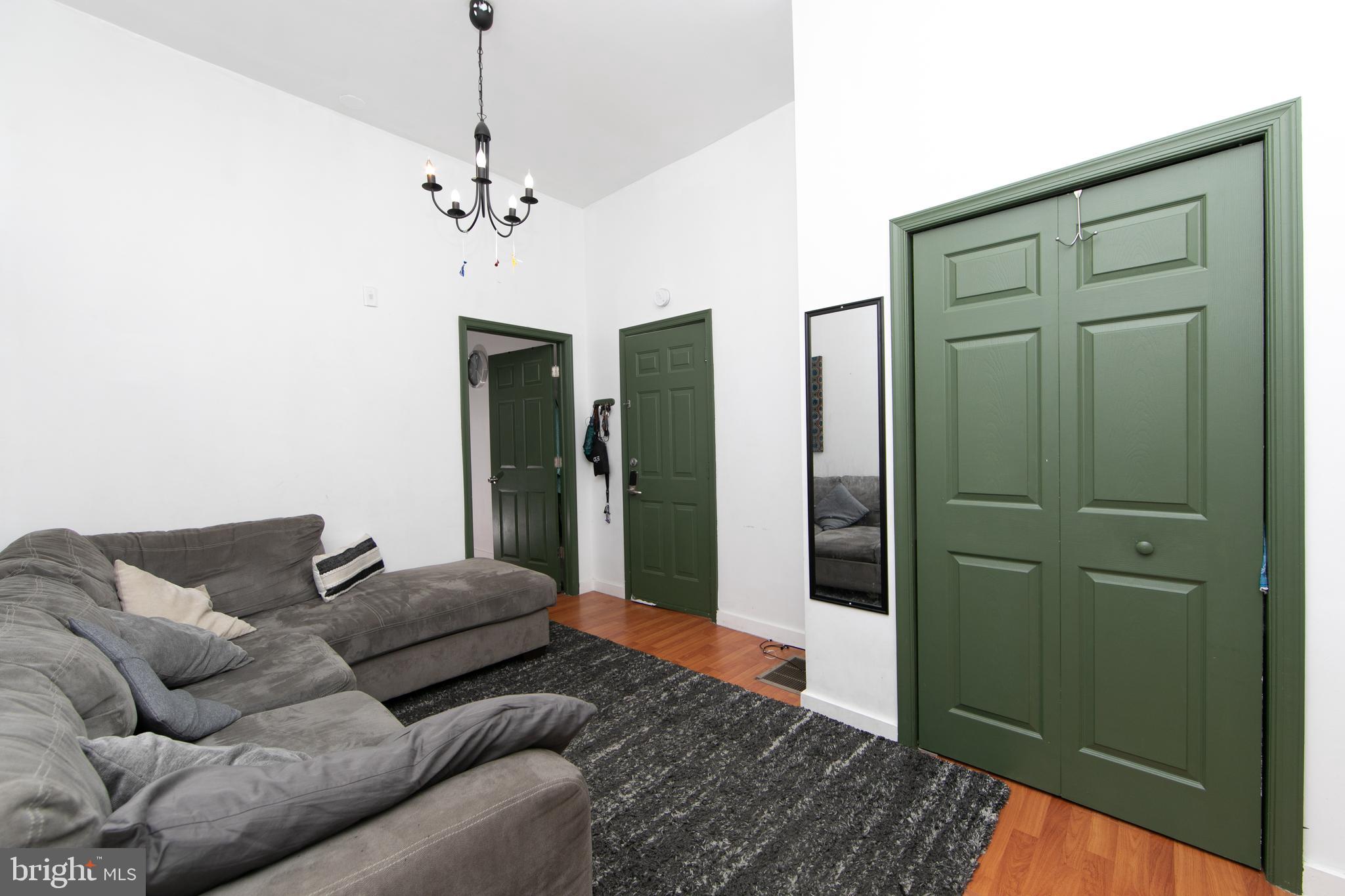 876 North 19th Street Philadelphia, PA 19130 - Photo 7 of 49 a living room with furniture and a chandelier