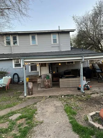 a view of a car park in front of house