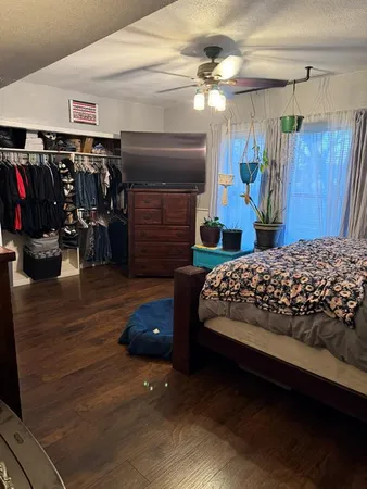 a bedroom with a bed and a walk in closet