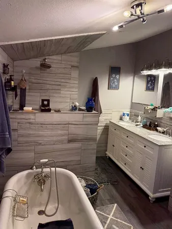 a kitchen with a sink and a refrigerator