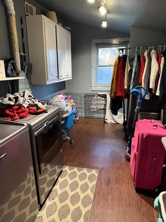 a bedroom with a bed and a walk in closet