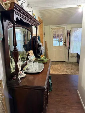 a view of a living room and entry way