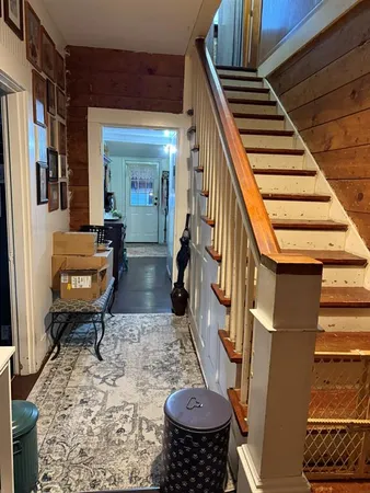 a living room with furniture and a rug