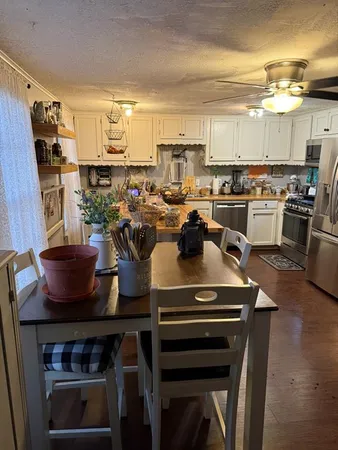 a kitchen with a table and chairs
