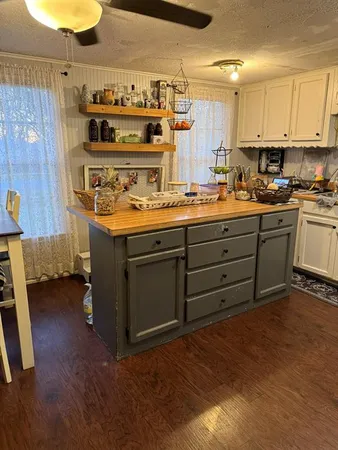 a kitchen with a stove and cabinets