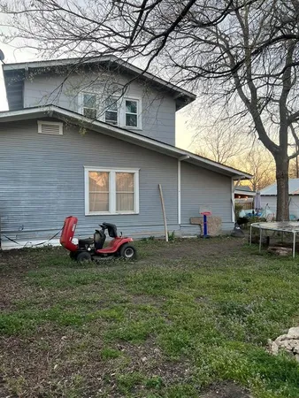a front view of a house with yard