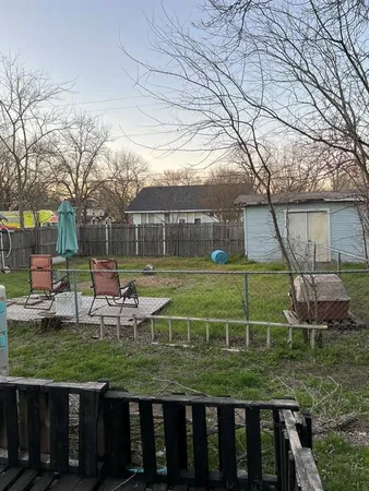 a view of a two chairs in the deck