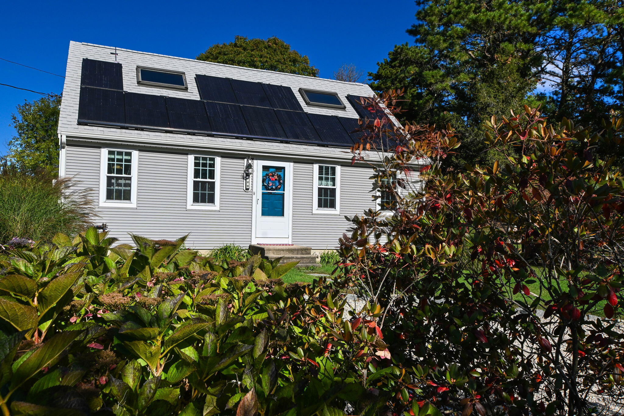 120 Snake Pond Road Forestdale, MA 02644 - Photo 2 of 32 a front view of a house with a garden