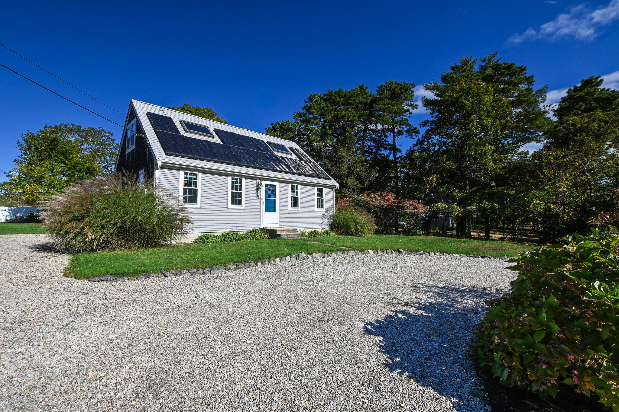 120 Snake Pond Road Forestdale, MA 02644 - Photo 3 of 32 a front view of a house with a yard and garage