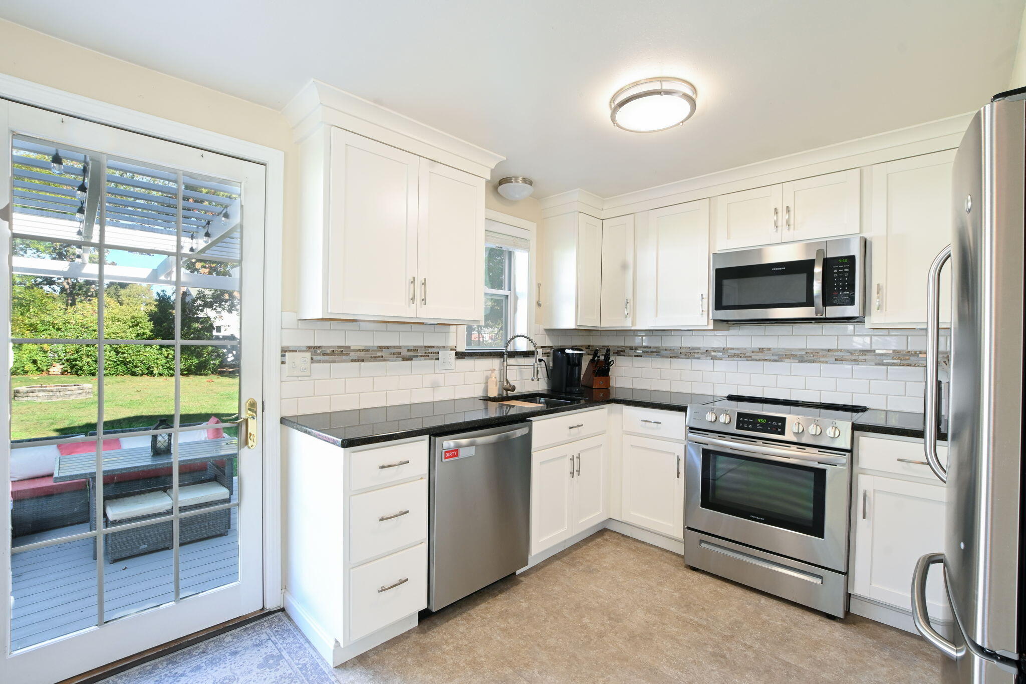 120 Snake Pond Road Forestdale, MA 02644 - Photo 7 of 32 a kitchen with cabinets stainless steel appliances and a window