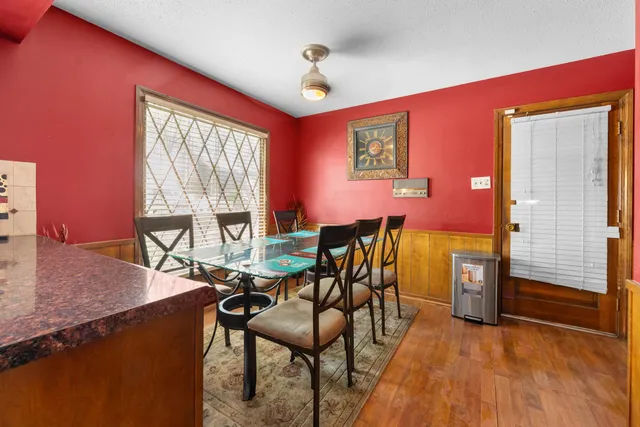 a dining room with furniture and window