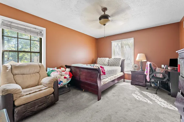 a bedroom with furniture and a window